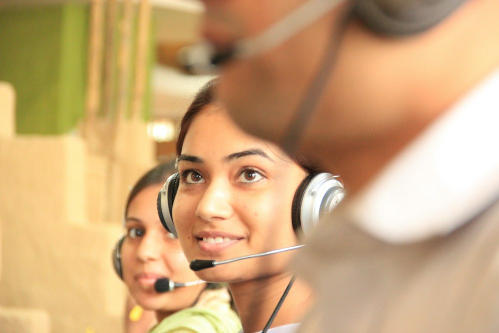 Smiling support agents in a bright office